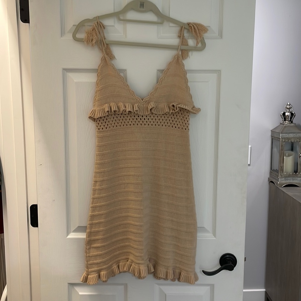 Tan crochet dress with cut out and tassels. Worn once in perfect condition